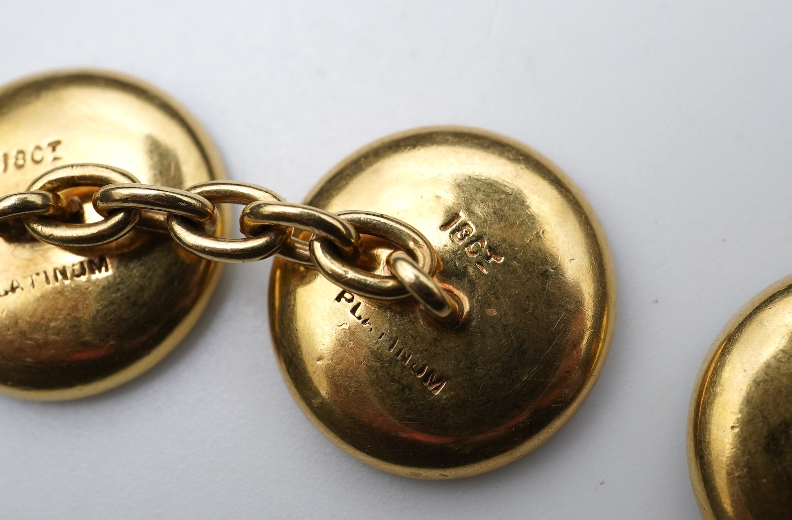 A pair of mother of pearl and sapphire cufflinks, early 20th century